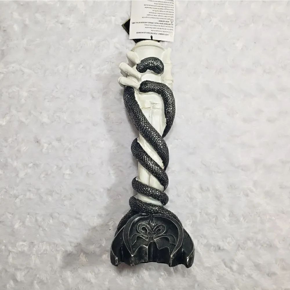 Skeleton hand and snake candle holder